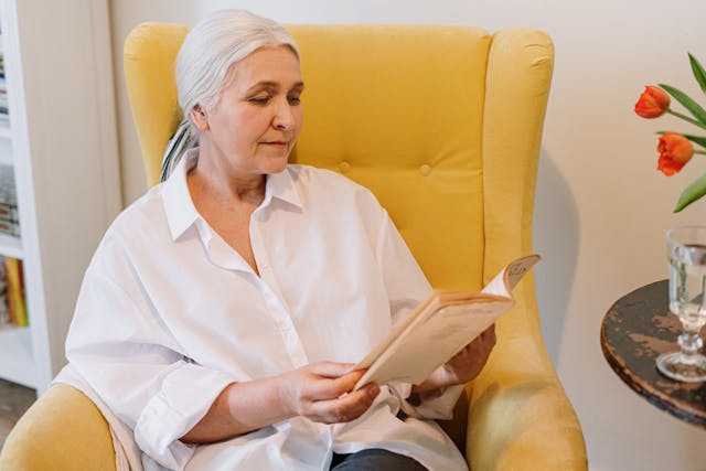 lady-reading-a-book-on-a-chair