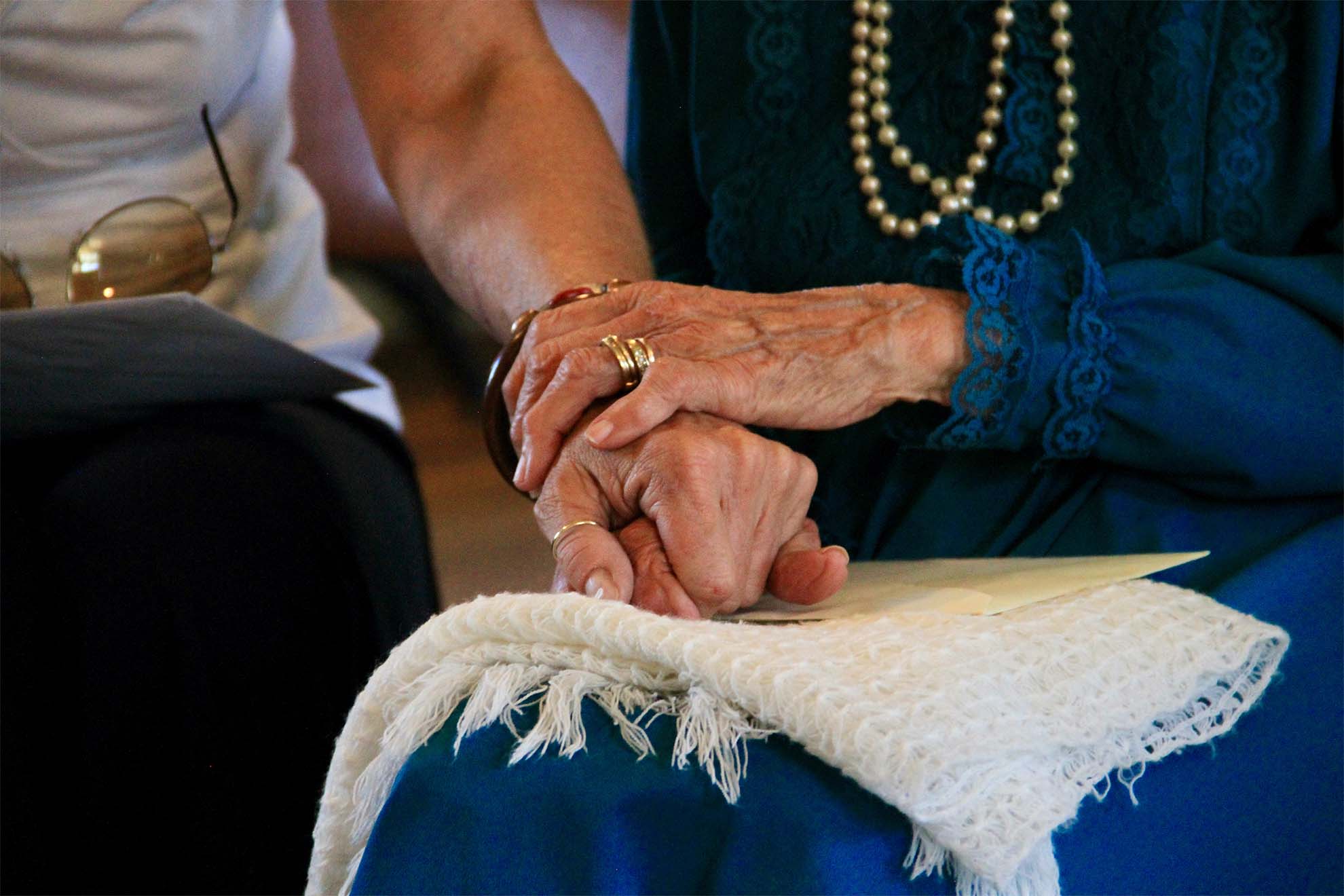 resident-holding-hands-with-family-member