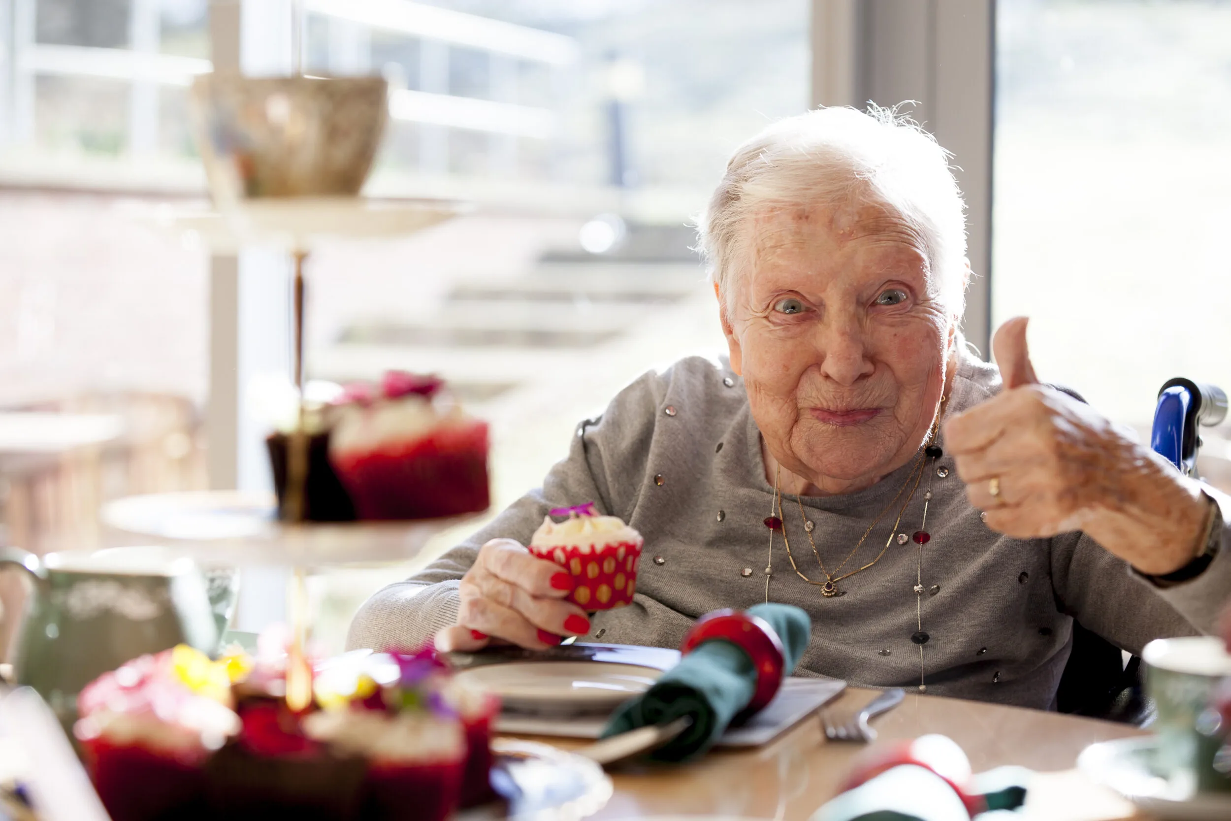 resident-holding-thumbs-up