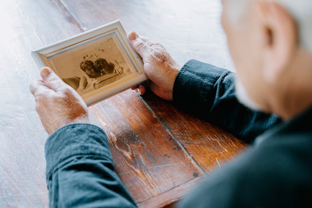 man-looking-at-photograph