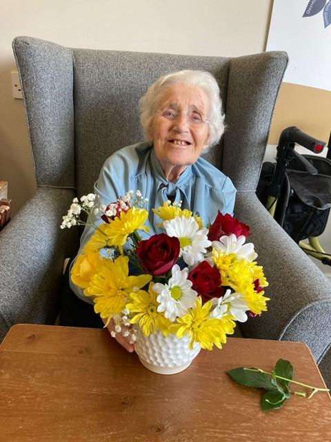 resident with flowers