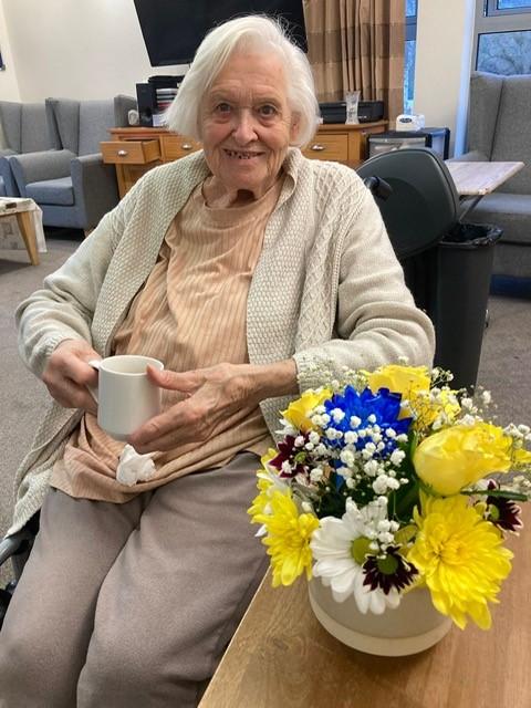 resident with flowers