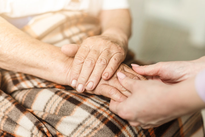 Old and young holding hands, Care for the elderly concept