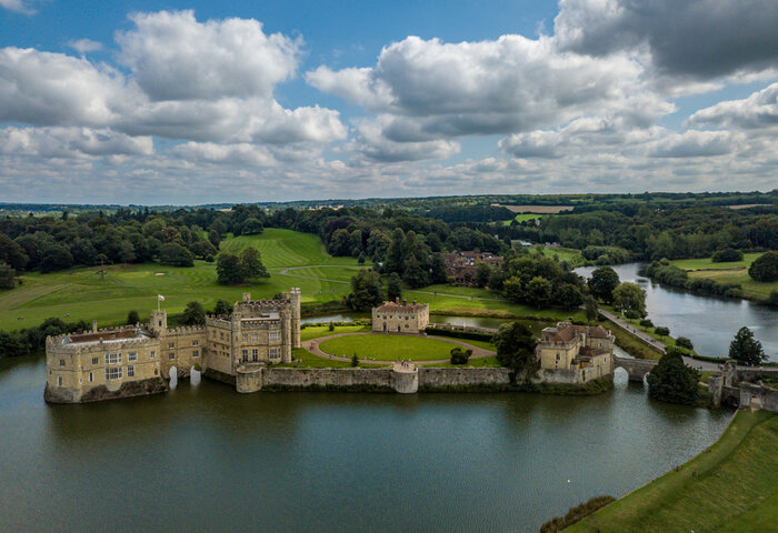 The drone arial view of Leeds castle.,Leeds Castle is a castle in Kent, England, southeast of Maidstone.,It is built on islands in a lake formed by the River Len.