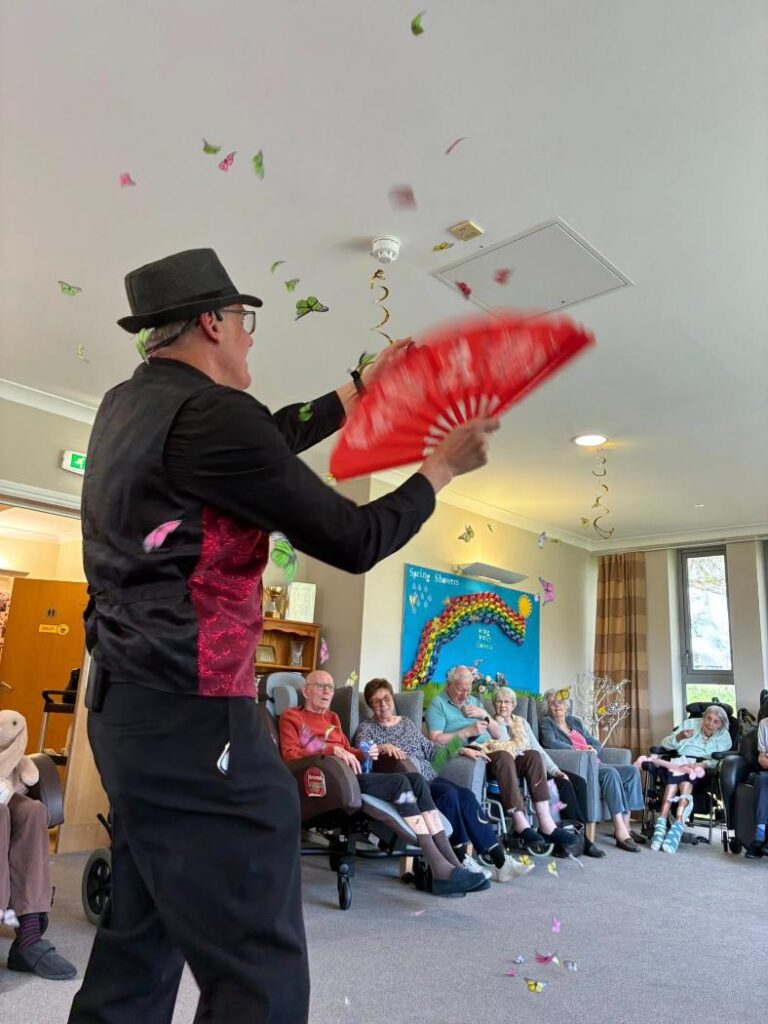 magic man entertainer in care home doing tricks