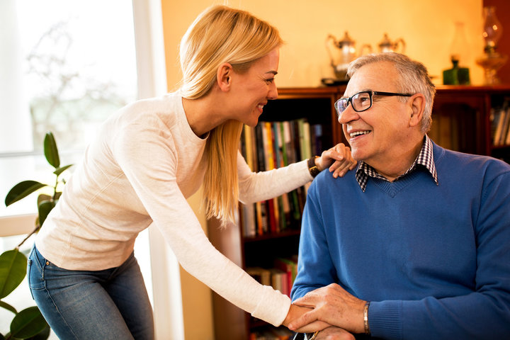 daughter talking to elderly father