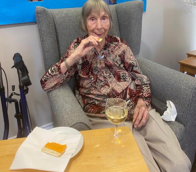 resident with cheese and wine