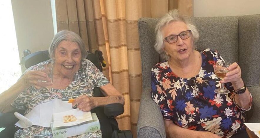 residents enjoying cheese and wine