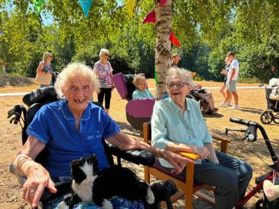 residents smiling with cat on her lap